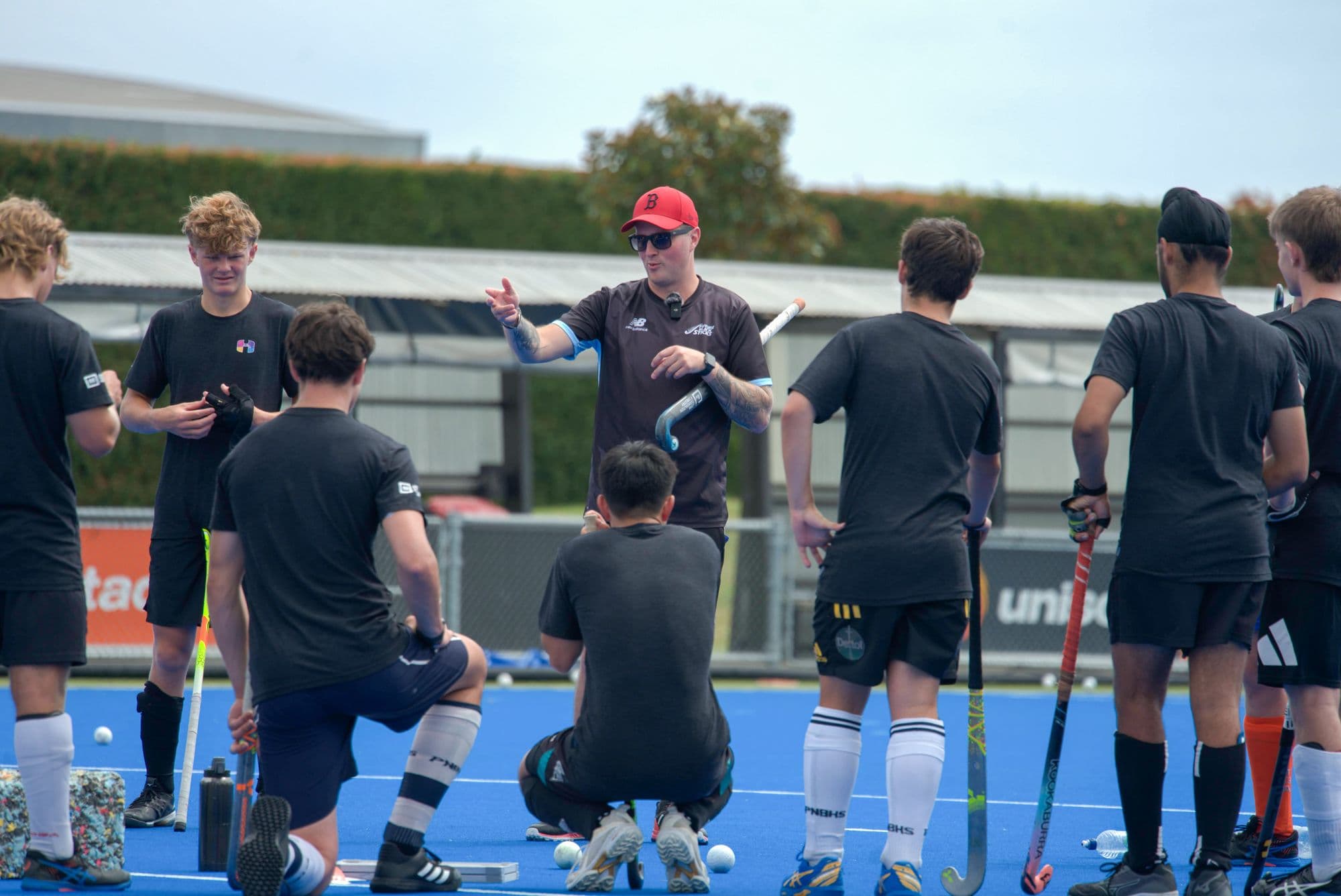An Inside Hockey coach working with a group of Pathway players.