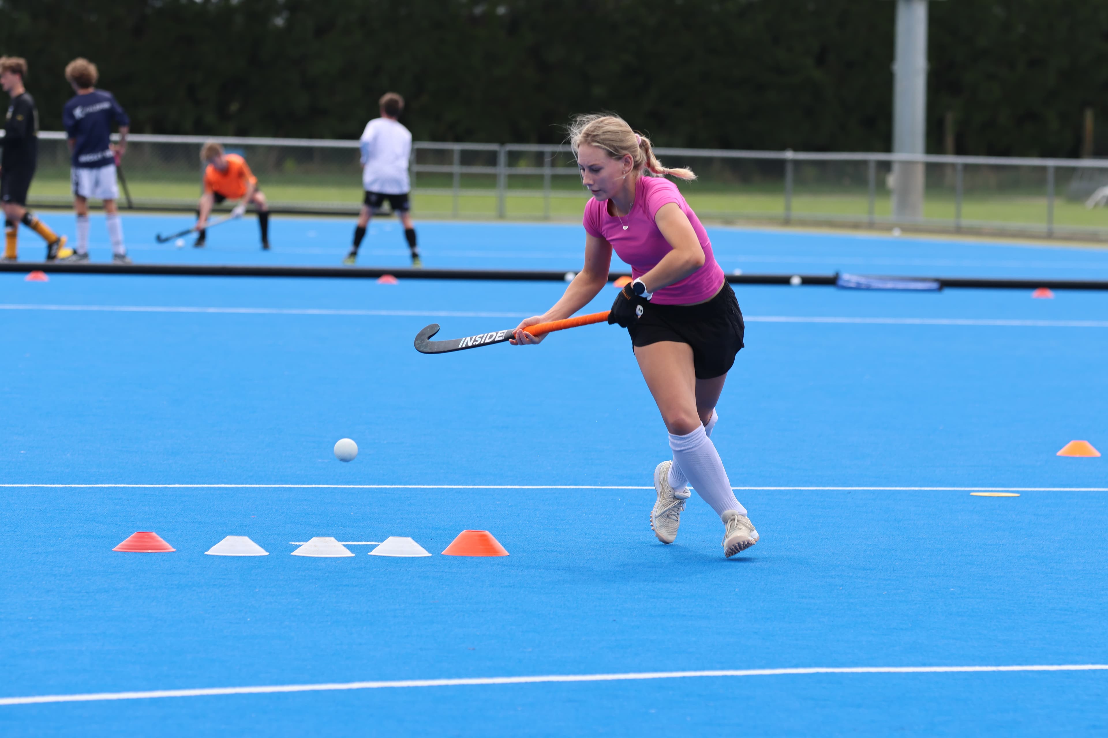 Emily practising an elimination skill during an Inside Hockey training session.